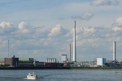 View of harbor by rhine river against sky