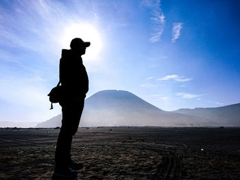 Silhouette of man standing on land