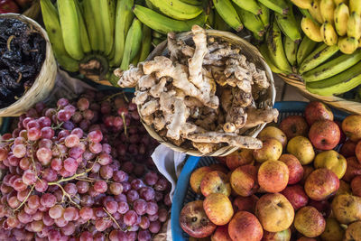 Overhead view of fruit and ginger at market.