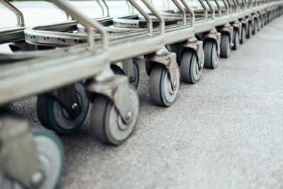 Cropped image of shopping carts on footpath