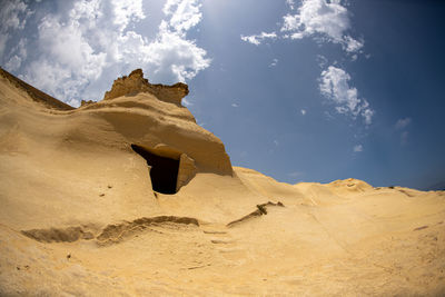 Low angle view of desert against sky