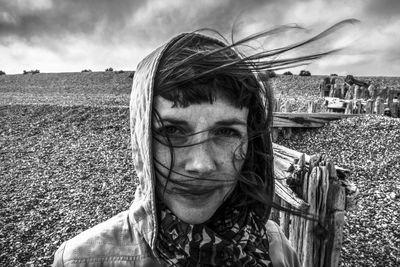 Portrait of young man on field