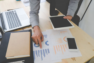 High angle view of man working on table