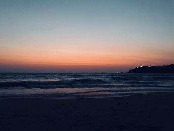 Scenic view of sea against sky at sunset