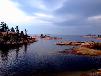 Scenic view of sea against cloudy sky