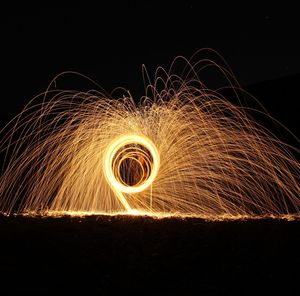 Light painting against sky at night