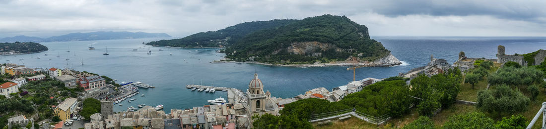 Panoramic view of sea and buildings against sky