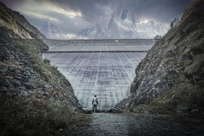 Scenic view of waterfall against sky