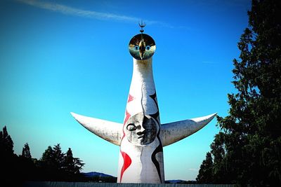 Statue against blue sky