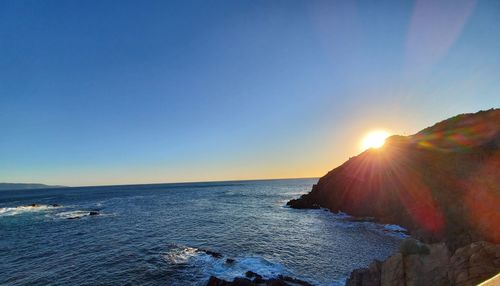 Scenic view of sea against sky at sunset