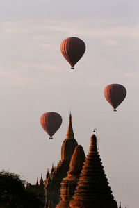 Low angle view of hot air balloons against sky