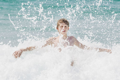 Portrait of man swimming in sea