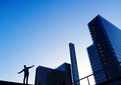 Low angle view of modern building against clear sky