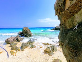 Scenic view of sea against blue sky