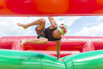 Portrait of man playing on bouncy castle