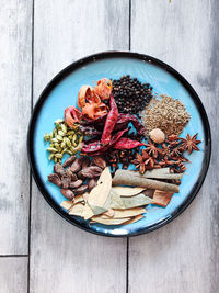 High angle view of chopped fruits in bowl on table