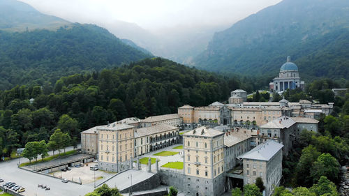 Aero view of beautiful shrine of oropa, facade with dome of the oropa sanctuary located in mountains