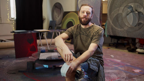 Portrait of man sitting at workshop