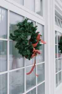 Front door with a christmas wreath and bows. home decor