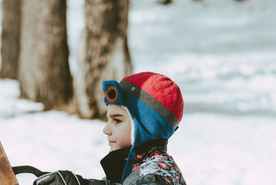 Close-up of boy wearing warm clothing during winter