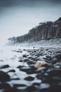 Scenic view of sea against sky during winter