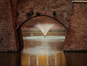 Fountain in the moat of the medieval castello estense in ferrara, italy