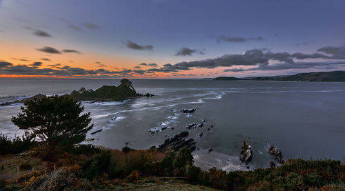 Scenic view of sea against sky during sunset