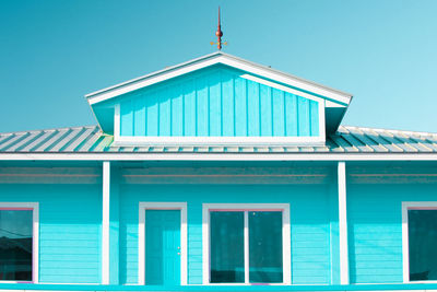 Low angle view of building against clear blue sky