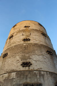 Low angle view of fort against blue sky