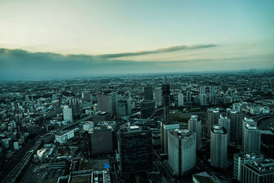 Aerial view of cityscape against sky