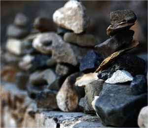 Stacked rocks on retaining wall