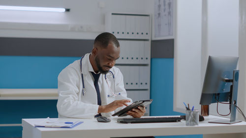 Female doctor working at clinic