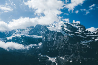 Scenic view of snow mountains against sky