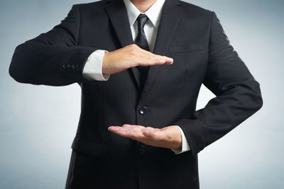 Close-up of man holding hands