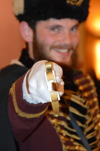 Portrait of smiling british royal guard holding sword