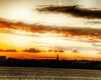 Scenic view of dramatic sky during sunset