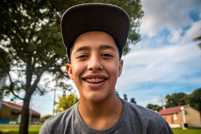 Close-up portrait of smiling teenage boy