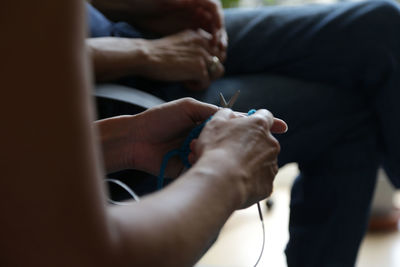 Close-up of hands knitting