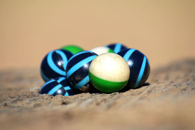 Close-up of balls on sand