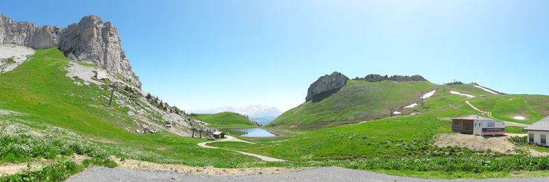 Scenic view of mountains against clear blue sky
