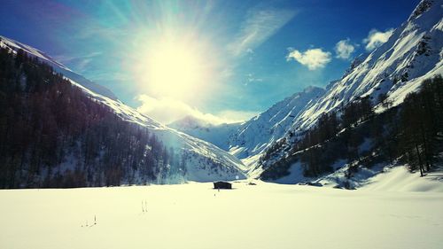 Scenic view of snow covered mountains