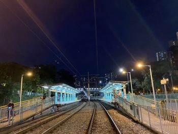 Illuminated railroad station at night