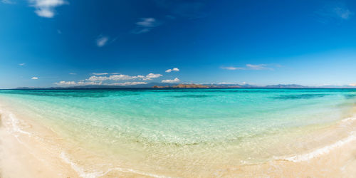 Scenic view of sea against blue sky