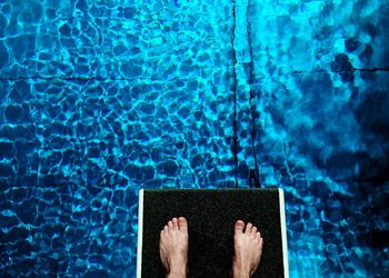 Low section view of person in swimming pool