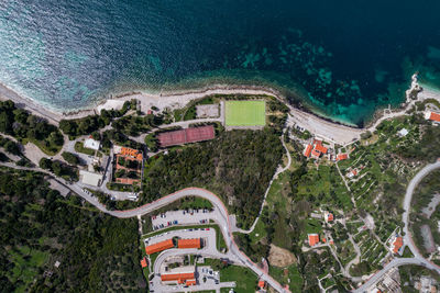 High angle view of townscape by sea