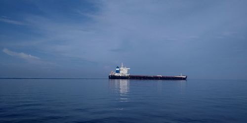 Ship in sea against sky