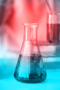Close-up of chemical in laboratory glassware on table
