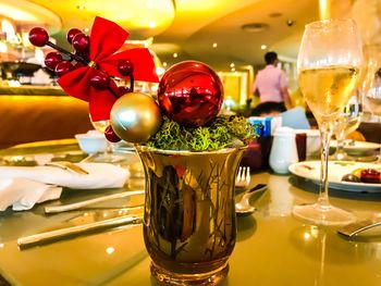 Close-up of wine glasses on table