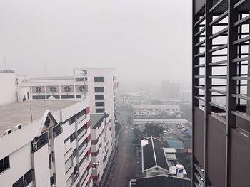 Panoramic view of buildings in city against sky