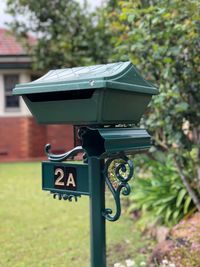 Close-up of mailbox on field